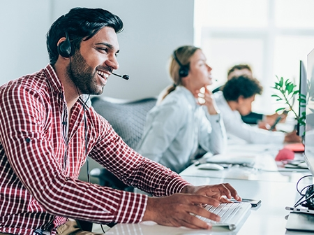 Customer service representatives at desks